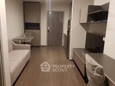 Modern living room with sleek furniture and stylish decor in a contemporary apartment.