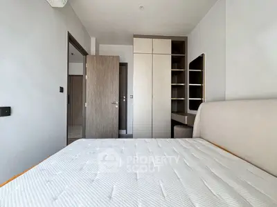 Modern bedroom with built-in wardrobe and minimalist design