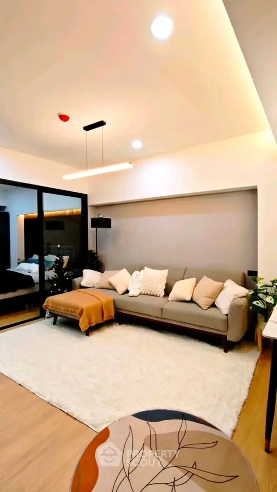 Modern living room with cozy sofa and elegant lighting