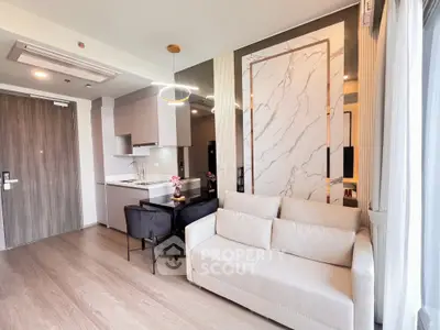 Modern living room with elegant decor and open kitchen layout