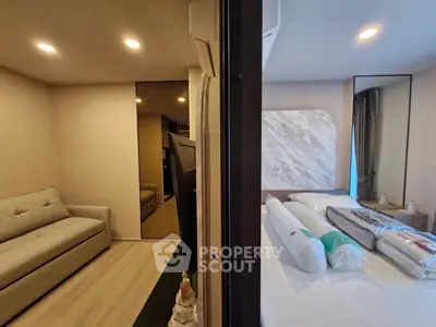 Modern bedroom with cozy sofa and stylish decor in a contemporary apartment