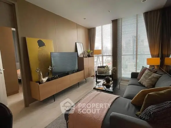 Stylish modern living room with floor-to-ceiling windows and chic decor