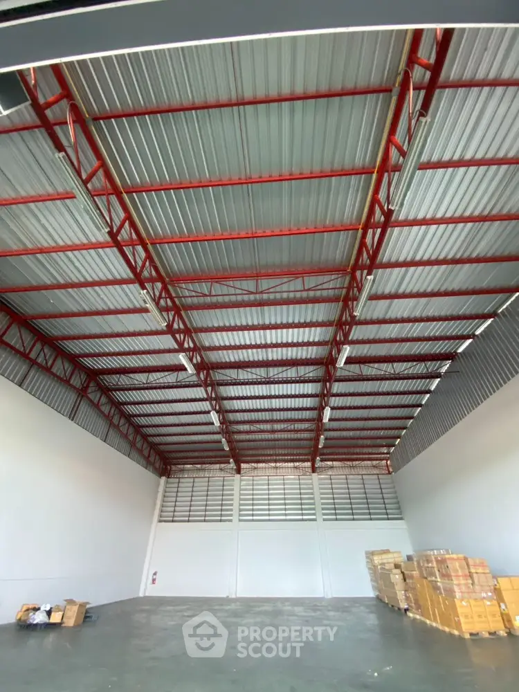 Spacious warehouse interior with high ceilings and ample storage space