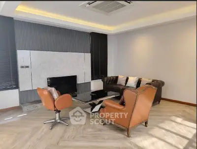 Luxurious living room with elegant leather chairs and modern decor