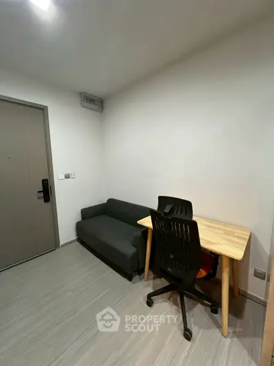 Compact study room with modern desk and chair, ideal for productivity.