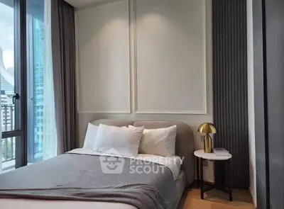 Modern bedroom with elegant decor and city view from large window