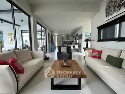 Spacious modern living room with elegant decor and natural light