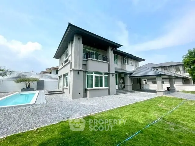 Stunning modern two-story home with pool and spacious yard, perfect for luxury living.