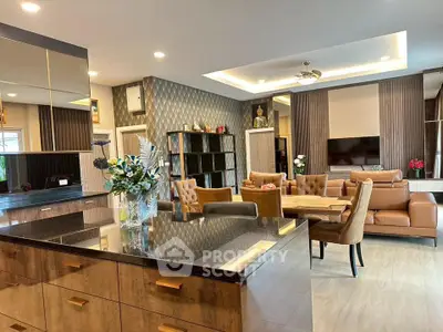 Luxurious open-plan living room with modern decor and elegant furnishings
