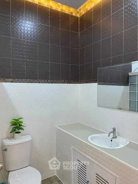 Modern bathroom with sleek tiles and stylish fixtures