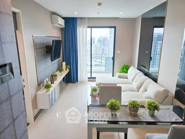 Modern living room with city view, elegant decor, and natural light