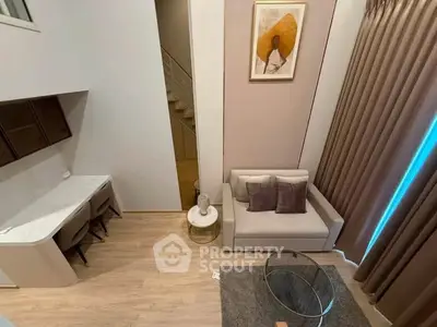 Modern living room with stylish decor and cozy seating area in a contemporary apartment.