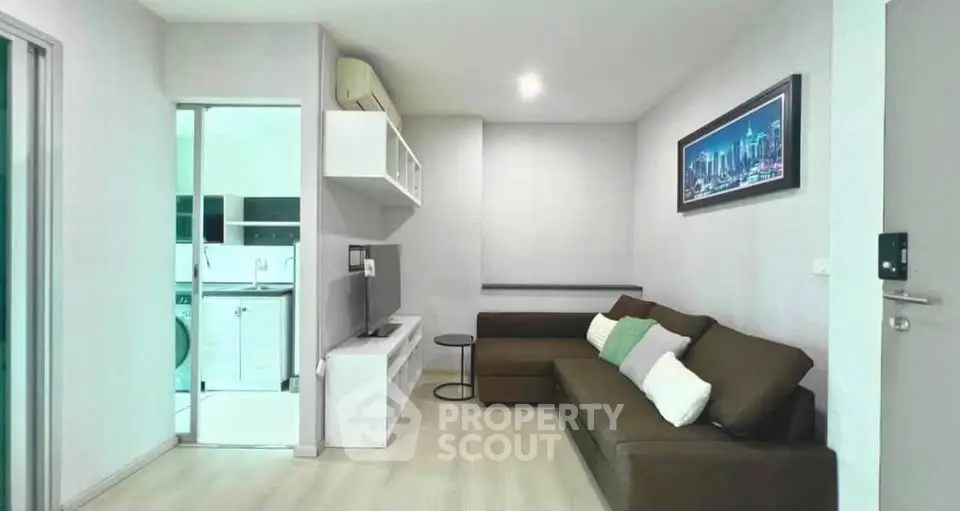 Modern living room with sleek furniture and stylish decor in a contemporary apartment.