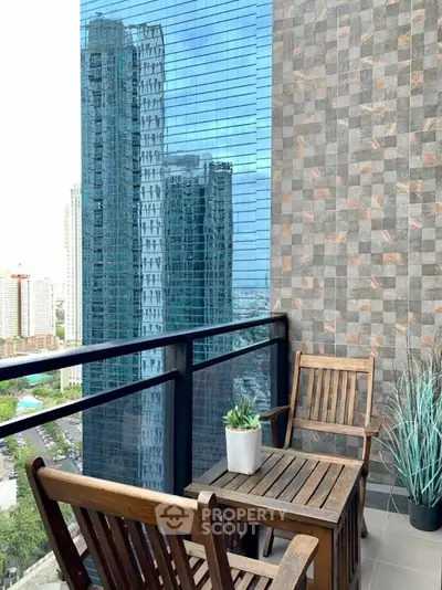 Stylish balcony with city view, modern furniture, and elegant wall design.