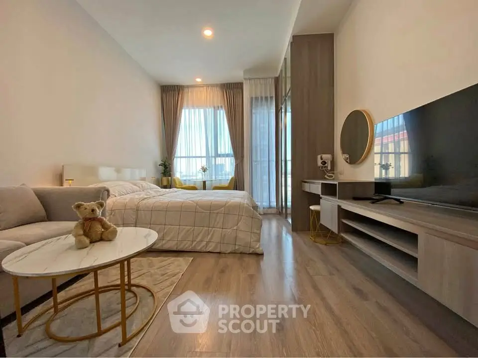 Modern studio apartment with cozy decor and natural light