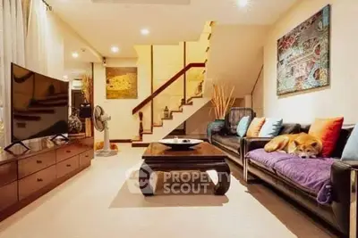 Spacious living room with modern decor and cozy ambiance.