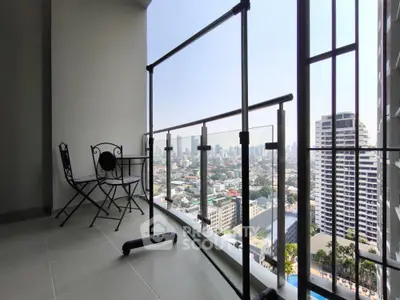 Spacious balcony with stunning city view and elegant outdoor seating