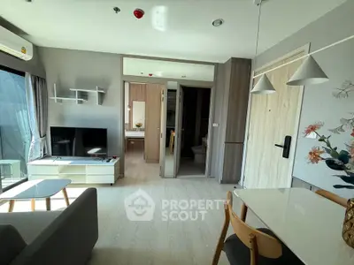 Modern living room with stylish decor and open layout in a contemporary apartment.