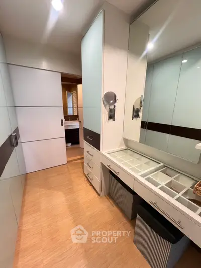 Spacious modern bathroom with sleek storage and elegant design