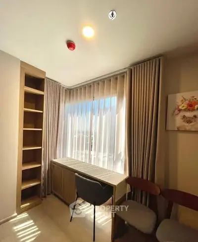 Bright study room with modern furniture and large window