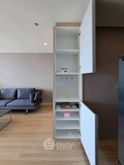 Modern living room with sleek storage cabinet and stylish sofa