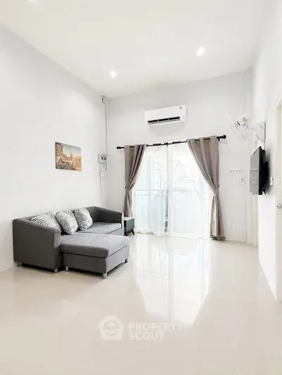 Spacious modern living room with sleek design and natural light