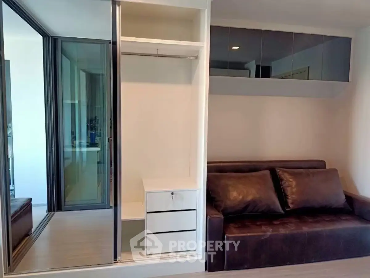 Modern living room with sleek storage and stylish leather sofa