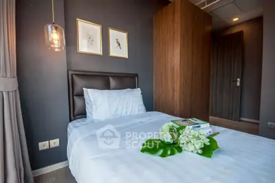 Cozy modern bedroom with elegant decor and soft lighting, perfect for relaxation.