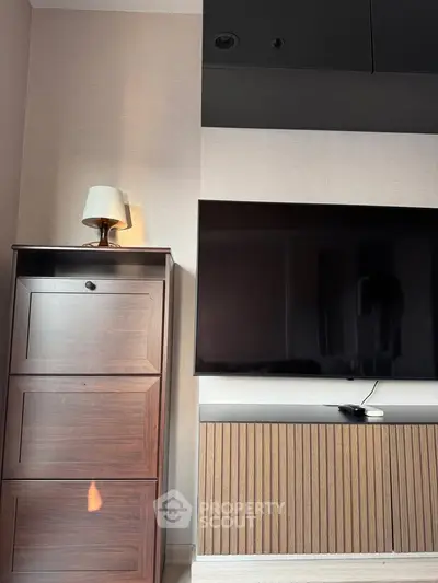 Modern living room with sleek TV and stylish wooden cabinet