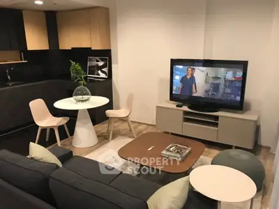 Modern living room with open kitchen and stylish furniture