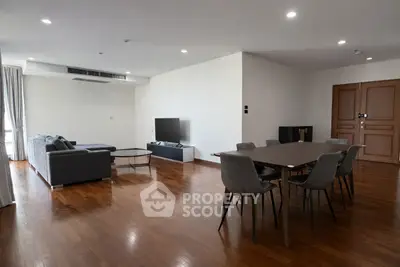 Spacious modern living room with dining area and wooden flooring