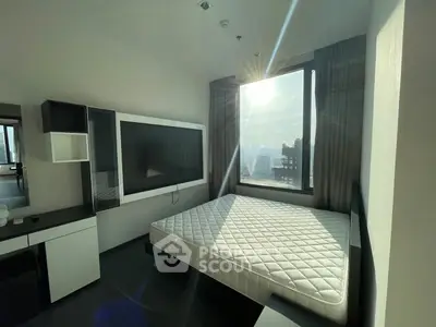 Modern bedroom with large window offering stunning city views and ample natural light.