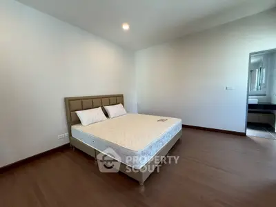 Spacious bedroom with modern design and ample natural light