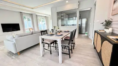 Modern open-plan living and dining area with stylish decor and natural light.