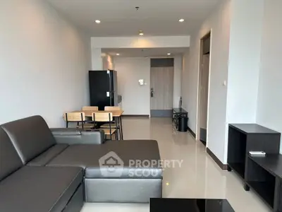 Modern living room with sleek furniture and open layout in a contemporary apartment.
