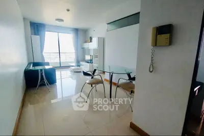 Spacious living room with modern furniture and large window view
