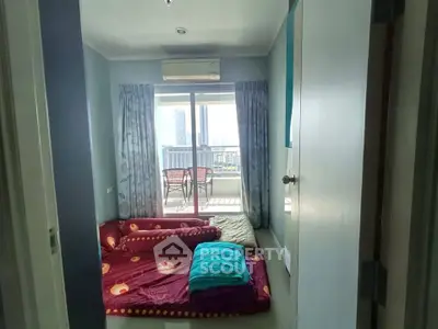 Cozy bedroom with balcony view in modern apartment