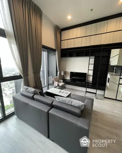 Luxurious high-rise living room with floor-to-ceiling windows offering panoramic city views, modern furniture, and an open-plan kitchen layout.