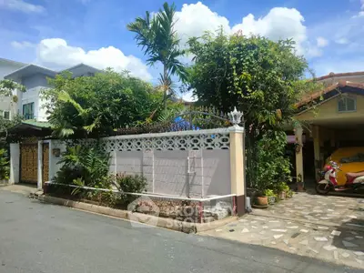 Charming suburban home with lush garden and secure gated entrance