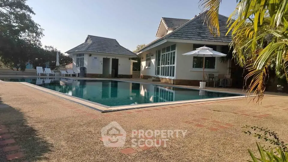 Charming property with a spacious pool and inviting outdoor area, perfect for relaxation and entertainment.