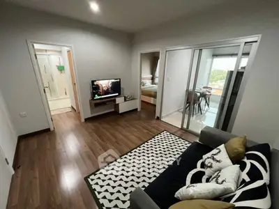 Modern living room with stylish decor and open view to dining area