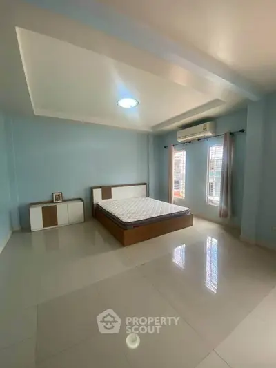 Spacious bedroom with modern design and natural light