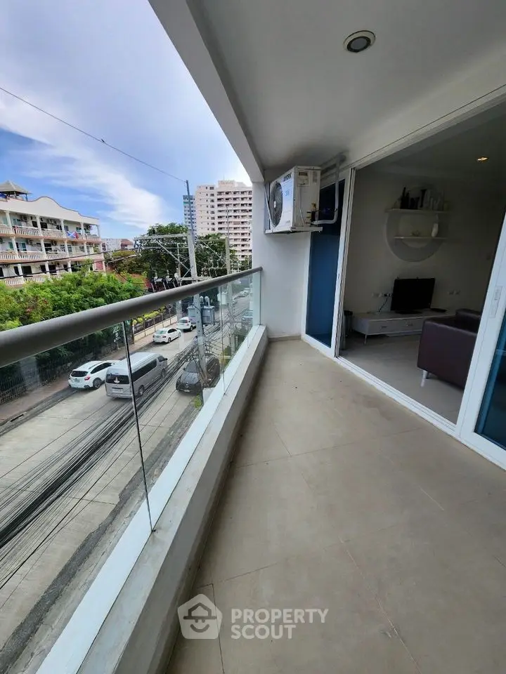 Spacious balcony with city view in modern apartment