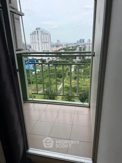 Charming balcony with stunning cityscape view, perfect for relaxation and enjoying the urban skyline.