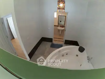 Spacious bathroom with jacuzzi tub and modern design