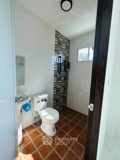 Modern bathroom with stylish tile design and natural light