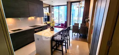 Luxurious open-layout kitchen and dining area with stunning city view