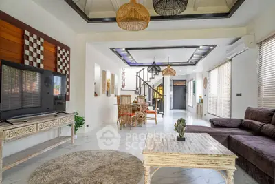 Spacious and stylish living room with modern decor and open layout, perfect for relaxation and entertainment.