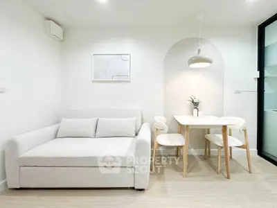 Modern minimalist living room with white sofa and dining area