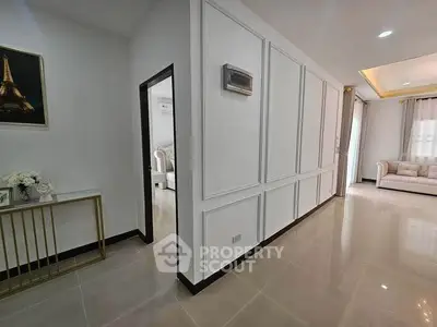 Spacious modern living area with elegant decor and natural light